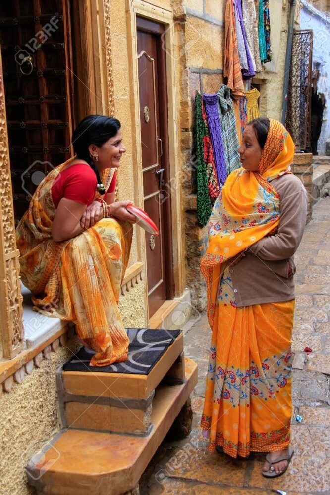 Indian women talking in the street of Jaisalmer fort, India
