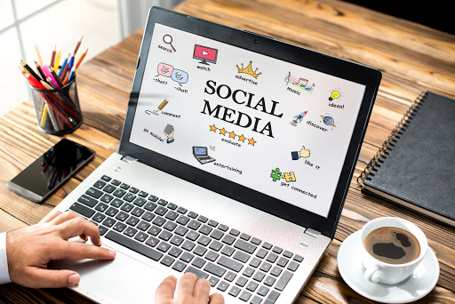 Social Media Concept On Laptop Screen With Various Doodle Icons