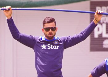 Virat Kohli in sunglasses during an India training session